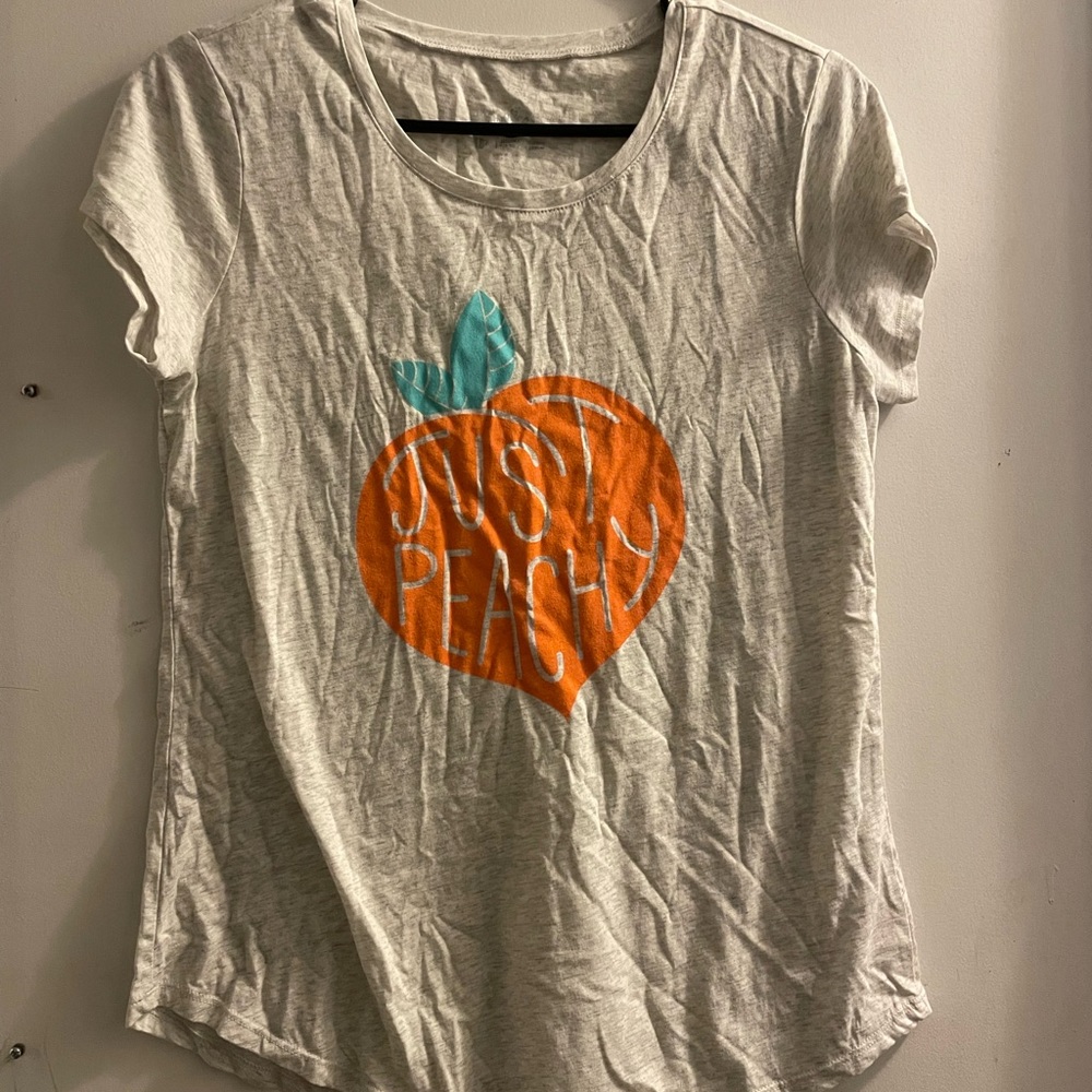 Justice t-Shirt. Says “just peachy” on the front.